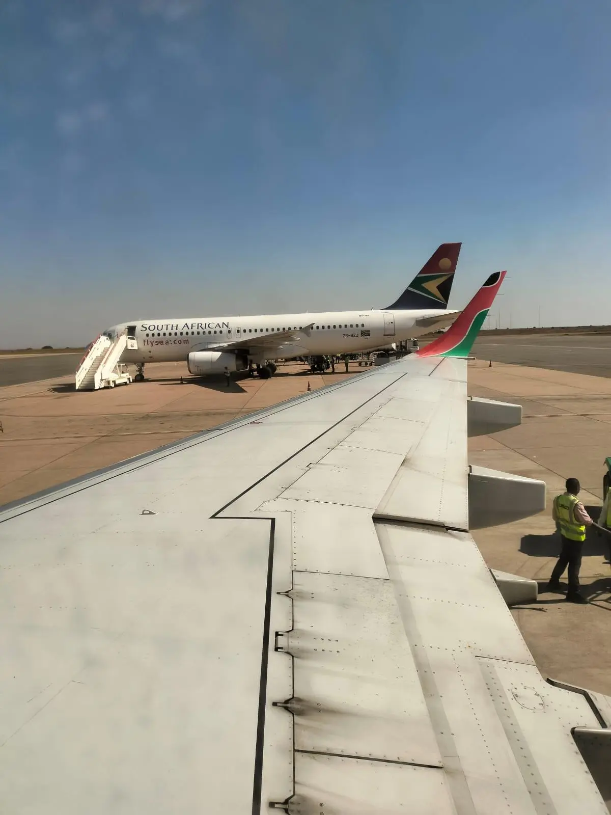 A Kenya Airways aircraft and a SAA at the Kamuzu Banda Airport in Lilongwe. Image: Gerald Andae