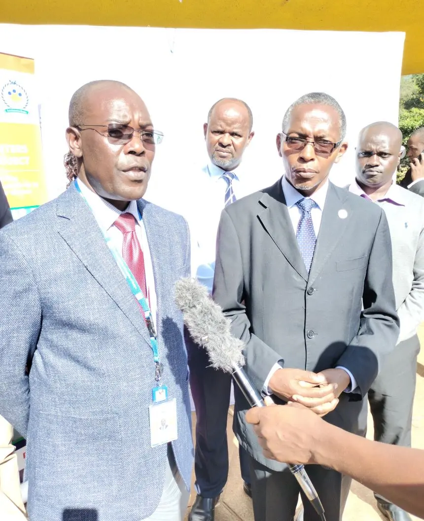 Cooperative University VC Prof Ngamau (left) receive the server manual. Image. BDA